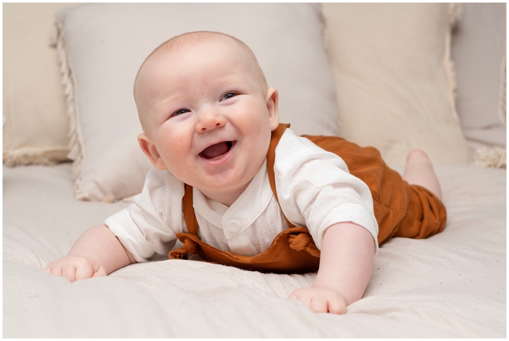 baby portraits on his belly