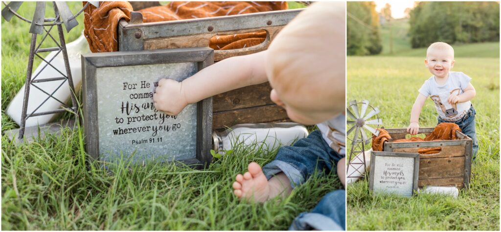 baby touching a precious sign