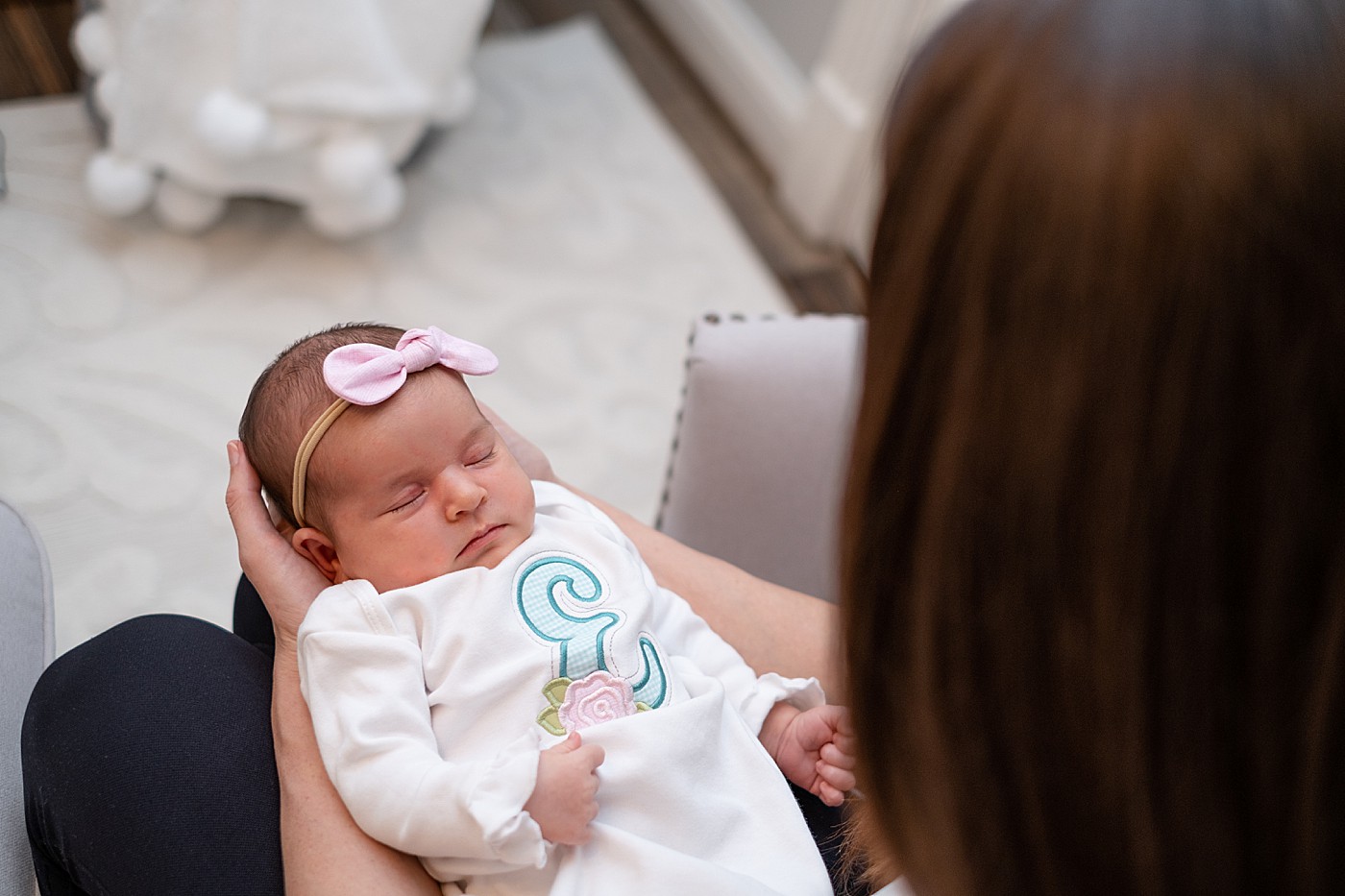 lifestyle baby portraits with mom looking down on baby in her arms