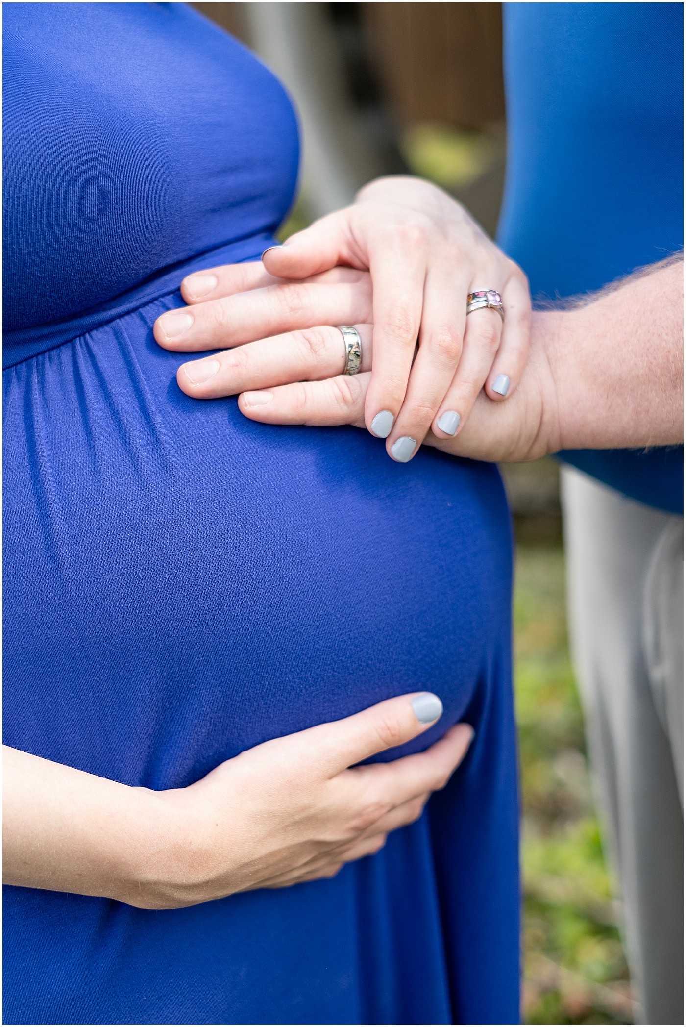 up close maternity portrait of hands on the belly