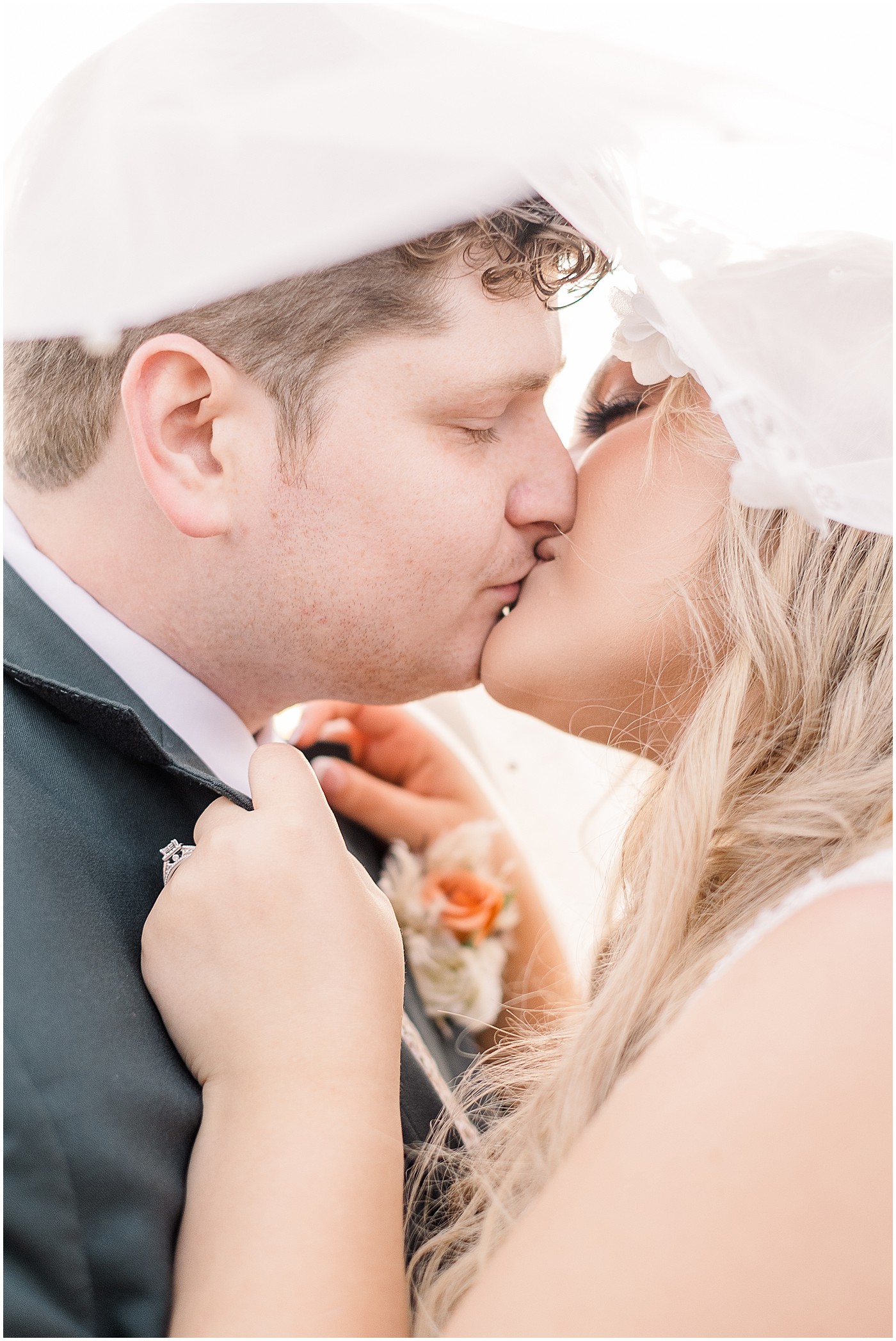 husband and wife enjoying a kiss on their autumn wedding day