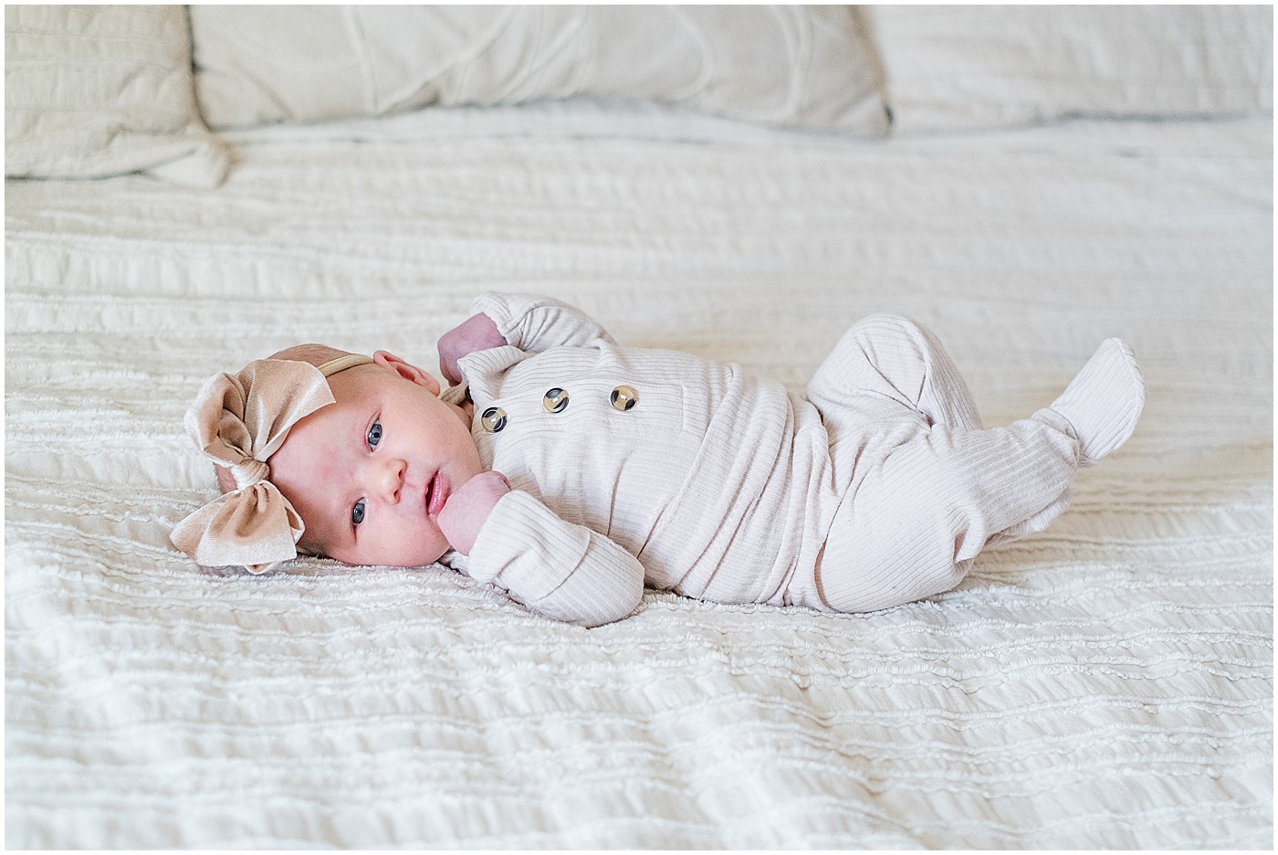 full length photo on the bed during newborn session