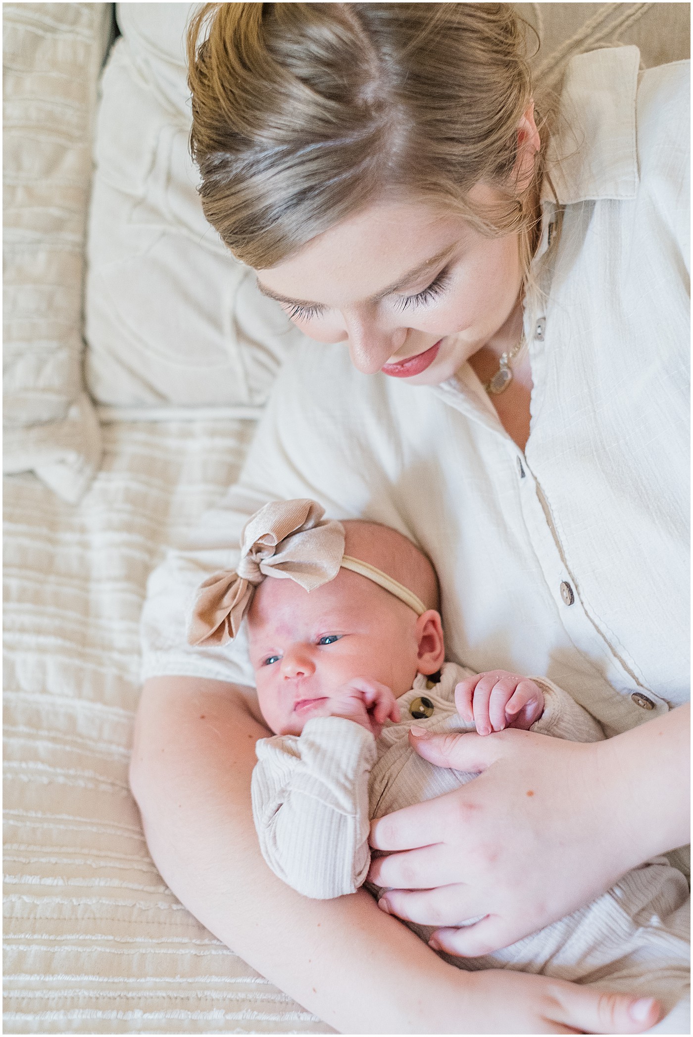 mommy admiring her newborn