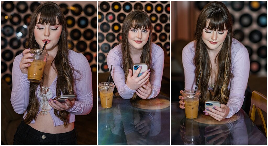 senior in purple shirt with coffee in one hand and her phone in the other