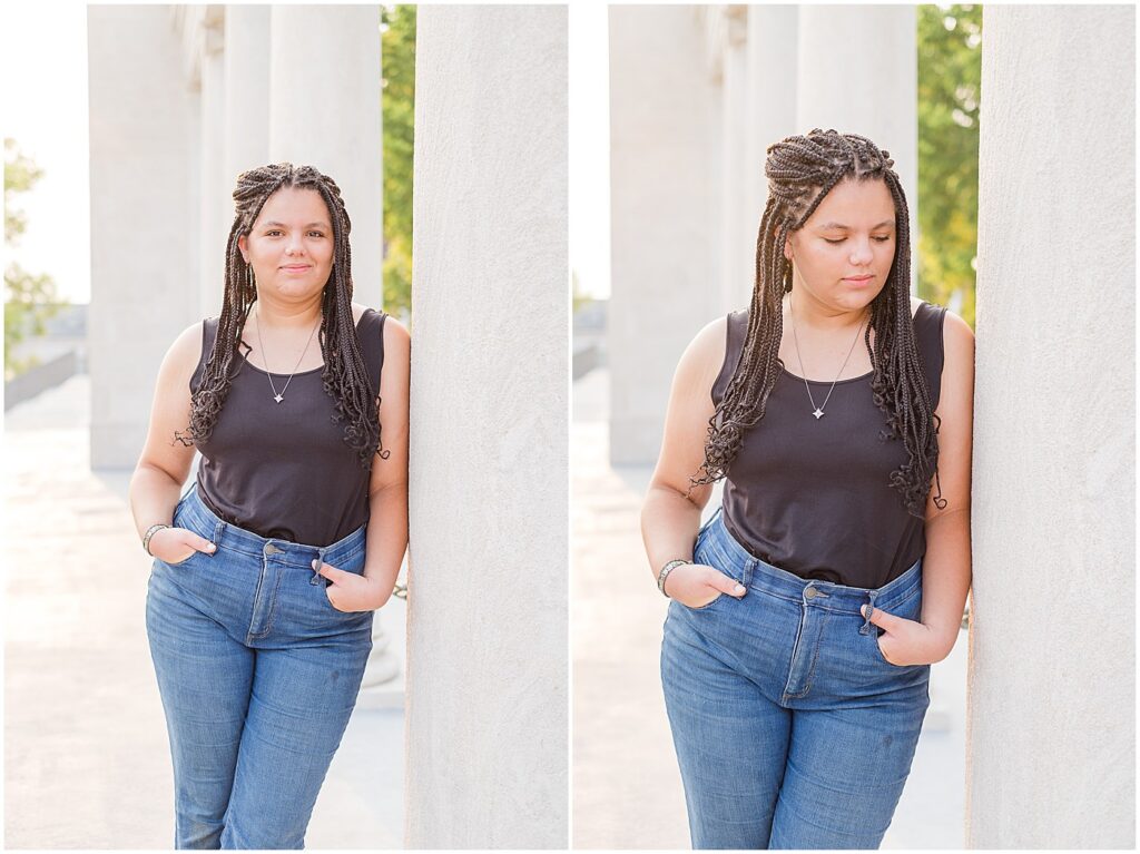 senior girl leaning on the columns in the colonnade at wku in her graduate portraits