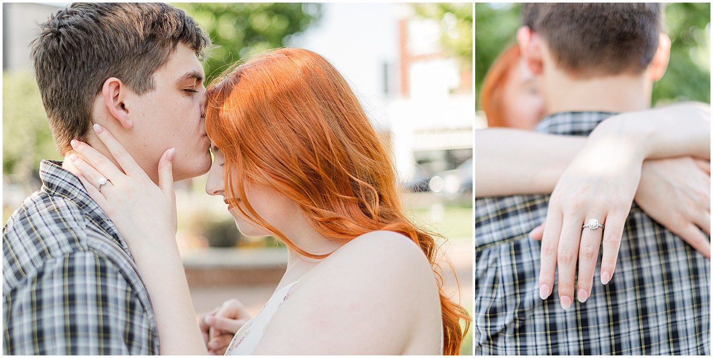 a man kissing a woman's forehead as her new engagement ring sparkles