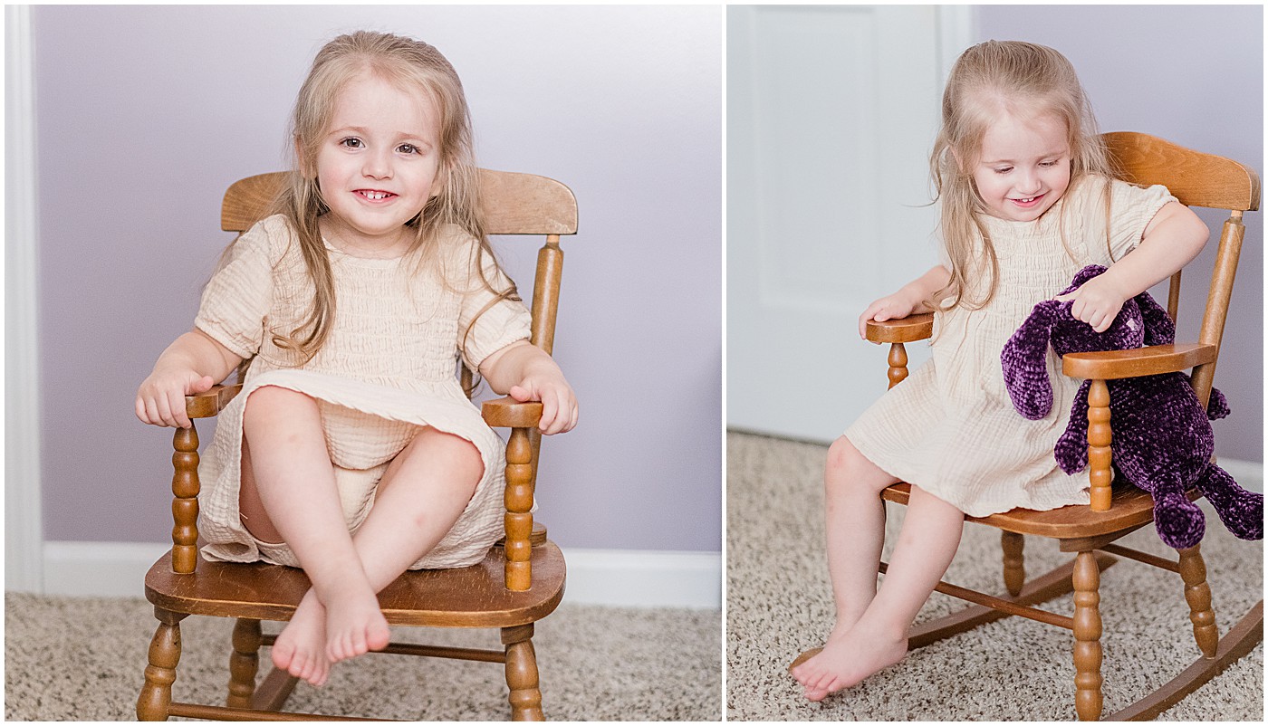 toddler in a little rocking chair with a purple bear with the initials AG