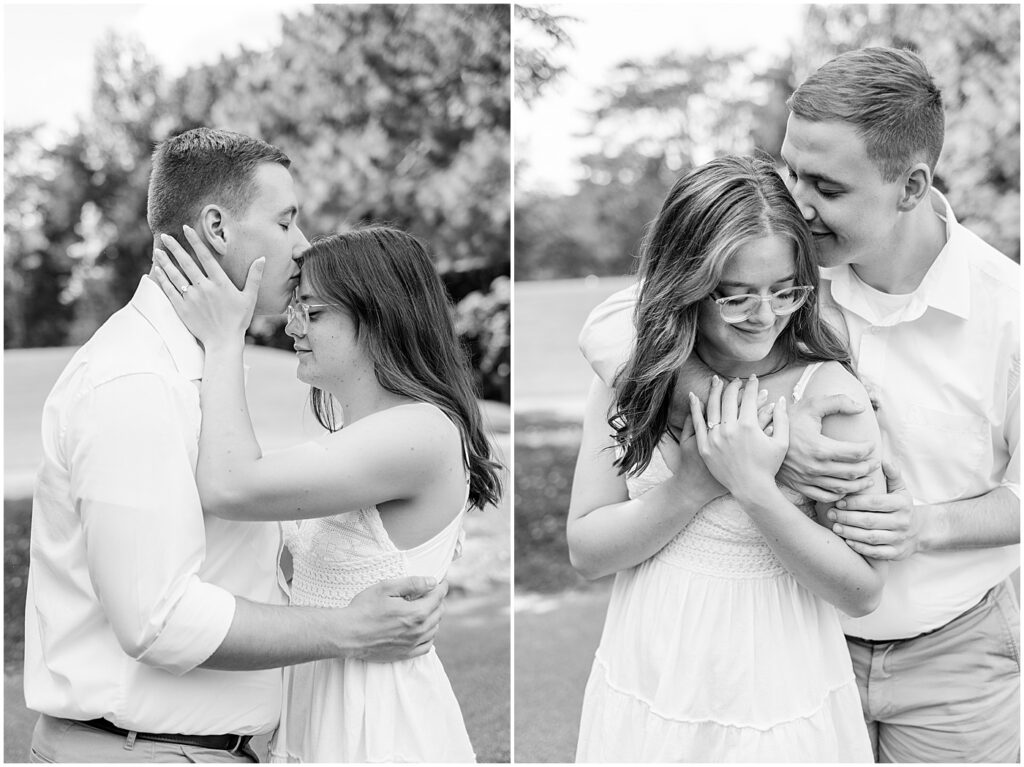 black and white image of man kissing woman's forehead during their outdoorsy engagement session