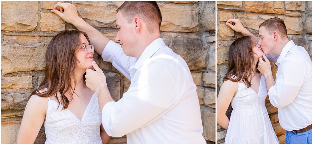 man leaning against wall at Barren River Lake Lodge kissing his fiancee