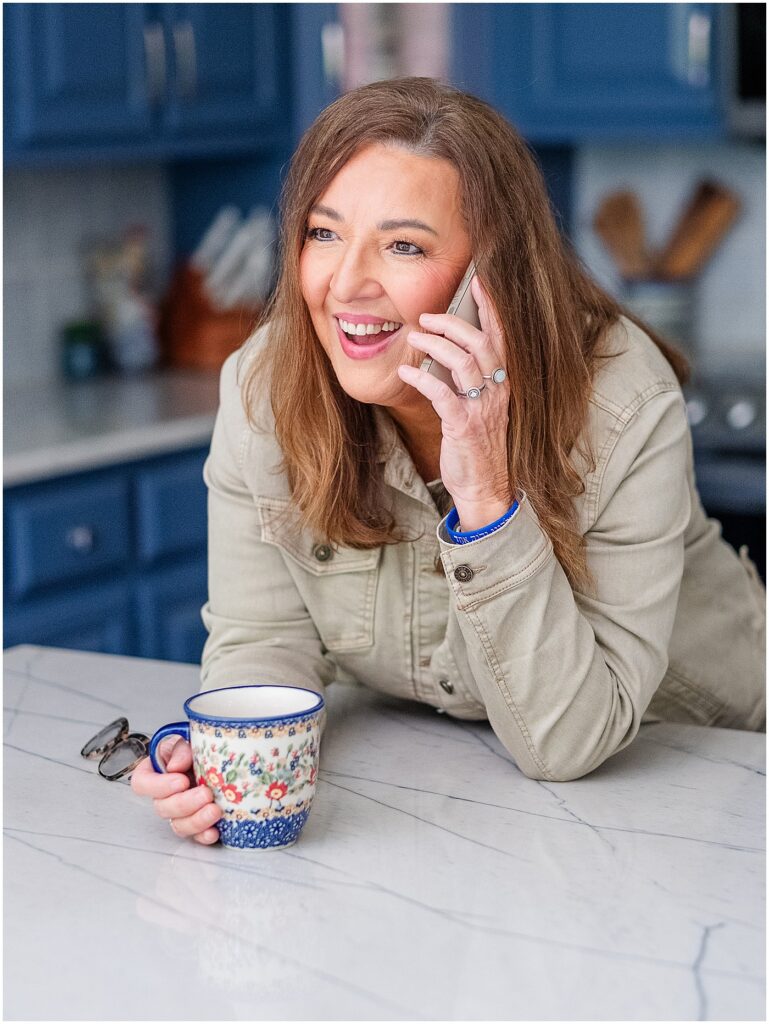 Glasgow real estate agent smiling on the phone with a client