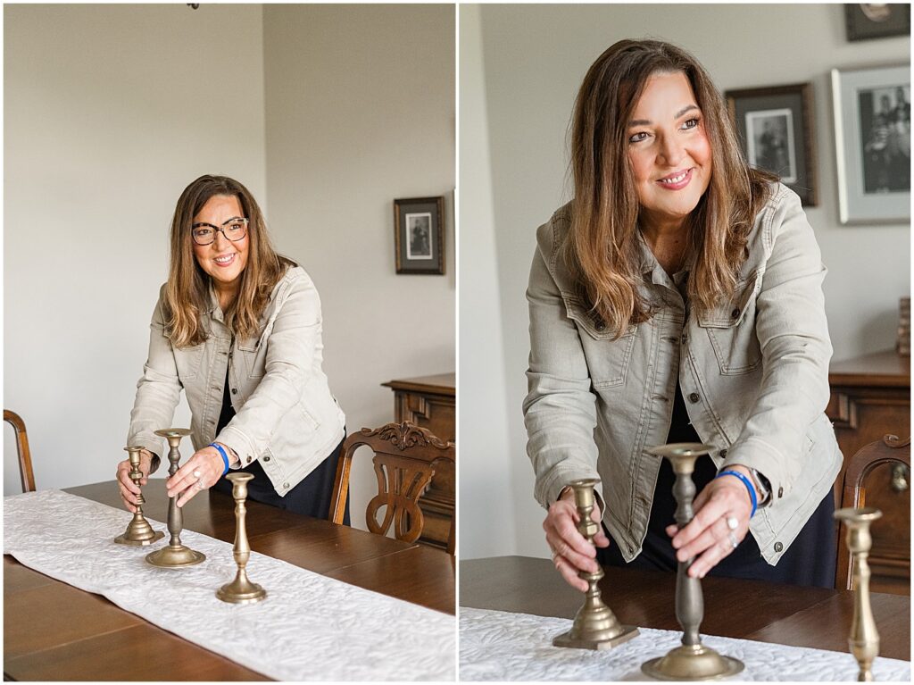 real estate agent setting candlesticks on table