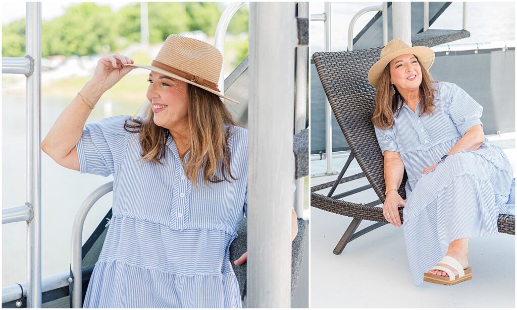 woman looking out at the lake while holding her hat