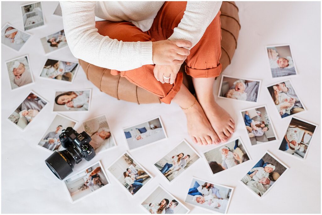 overhead image of photographer surrounded by photos and camera 