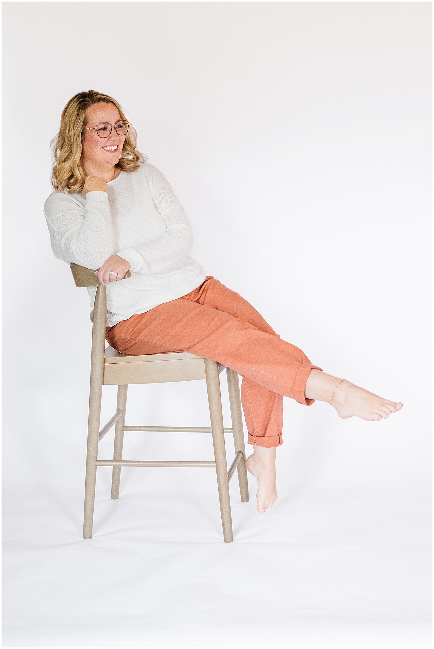 Bowling Green photographer sitting in a chair on her photography branding session