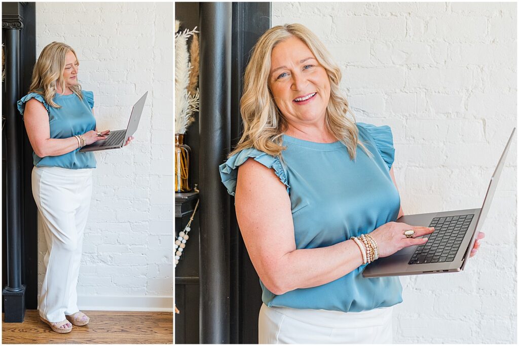 photographer standing and holding her laptop