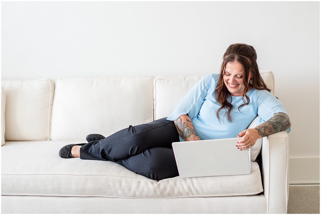 Lexington photographer editing on a couch