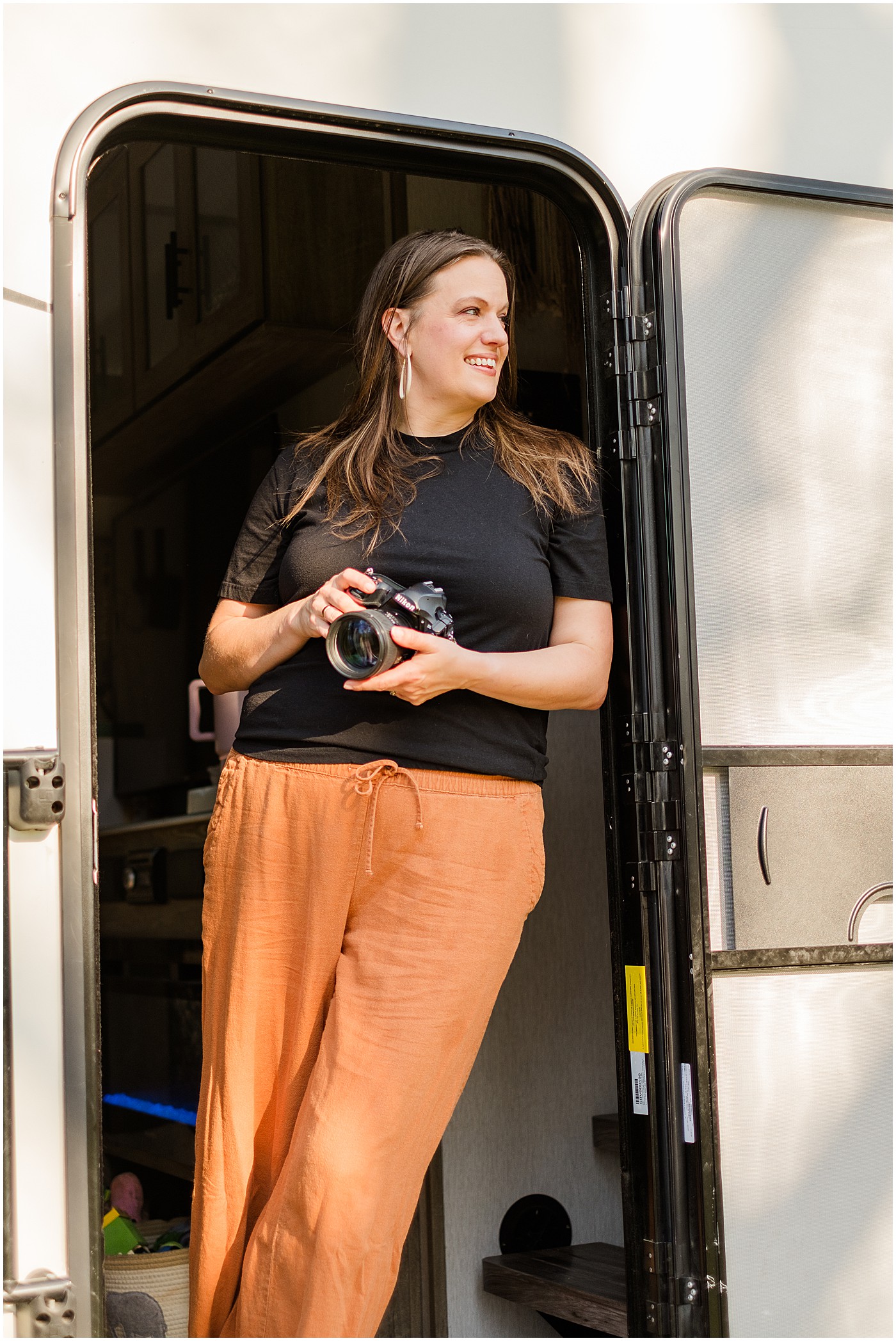 photographer posing in doorway of her rv