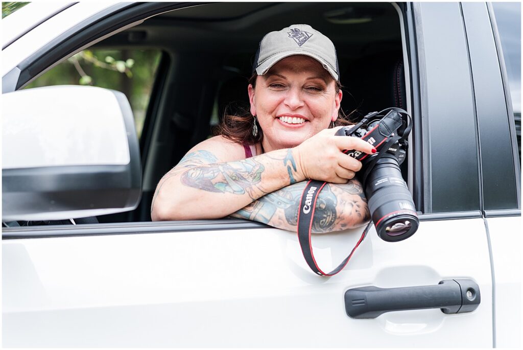 Lexington photographer in her truck with her camera