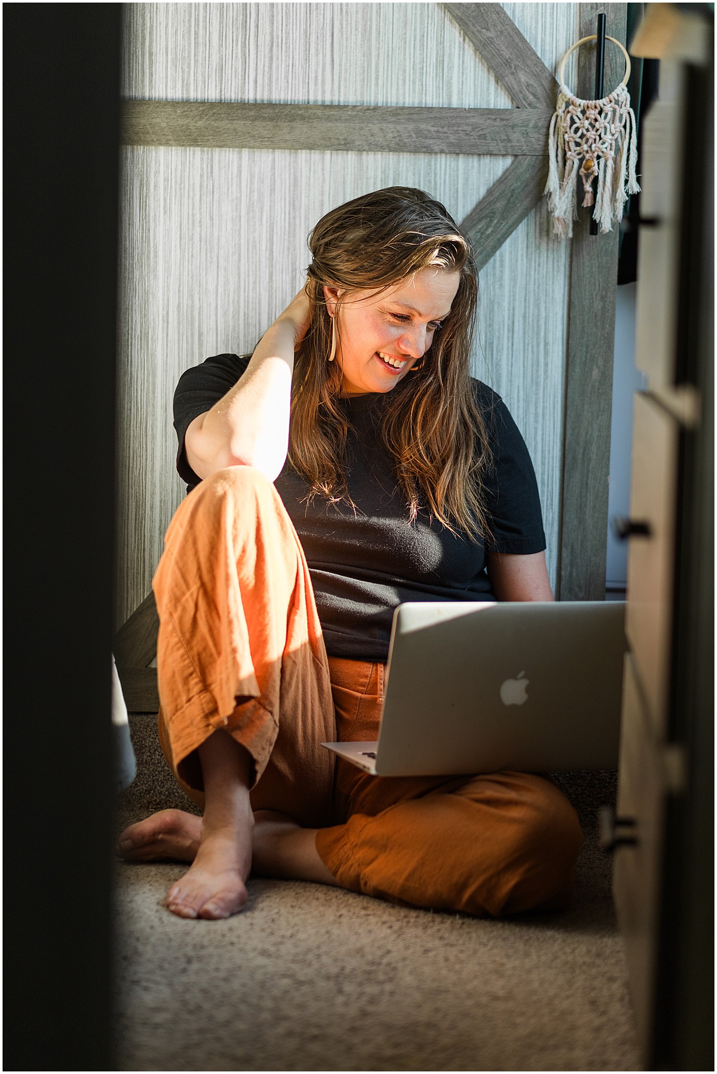 traveling photographer edits in bedroom of her RV