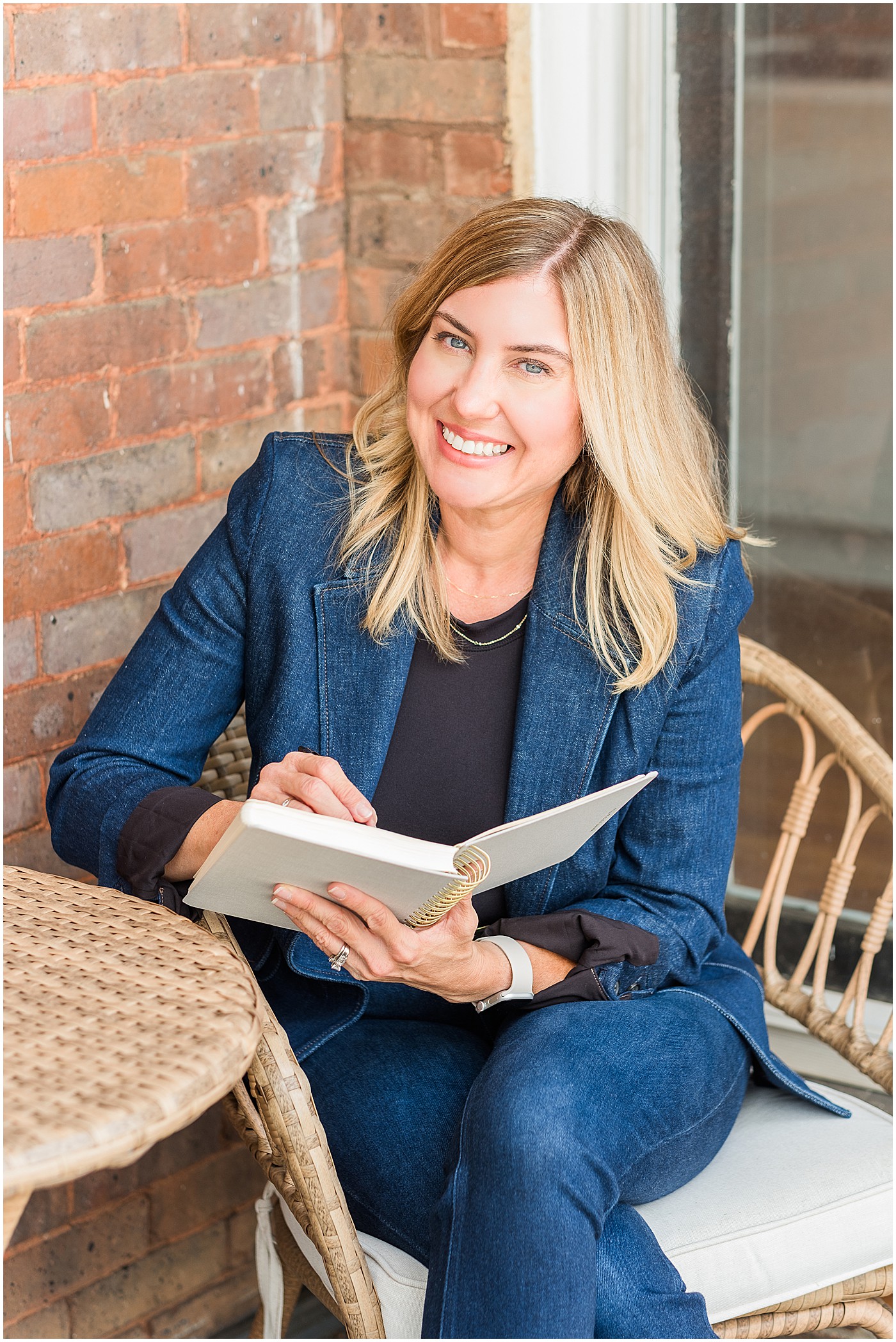 outdoor photo of coach writing in journal