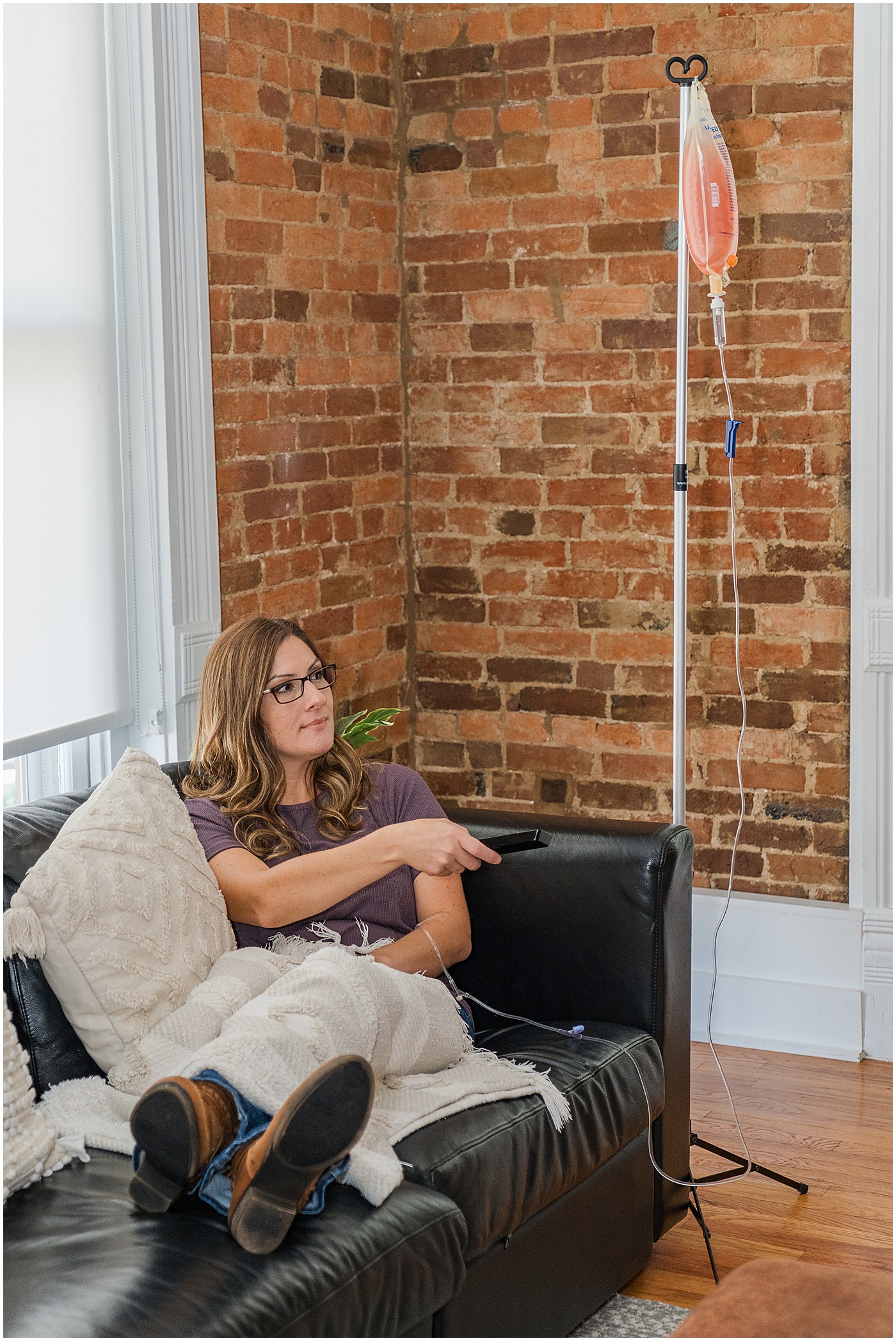 east main bg is one of our favorite bowling green branding locations. this shows woman on couch getting iv infusion while watching television